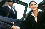 Woman exiting chauffeur's car (Image)